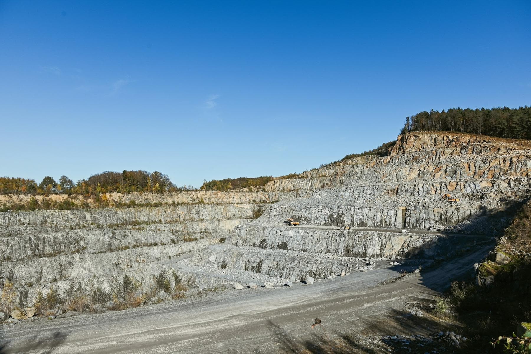 Terraced granite quarry face