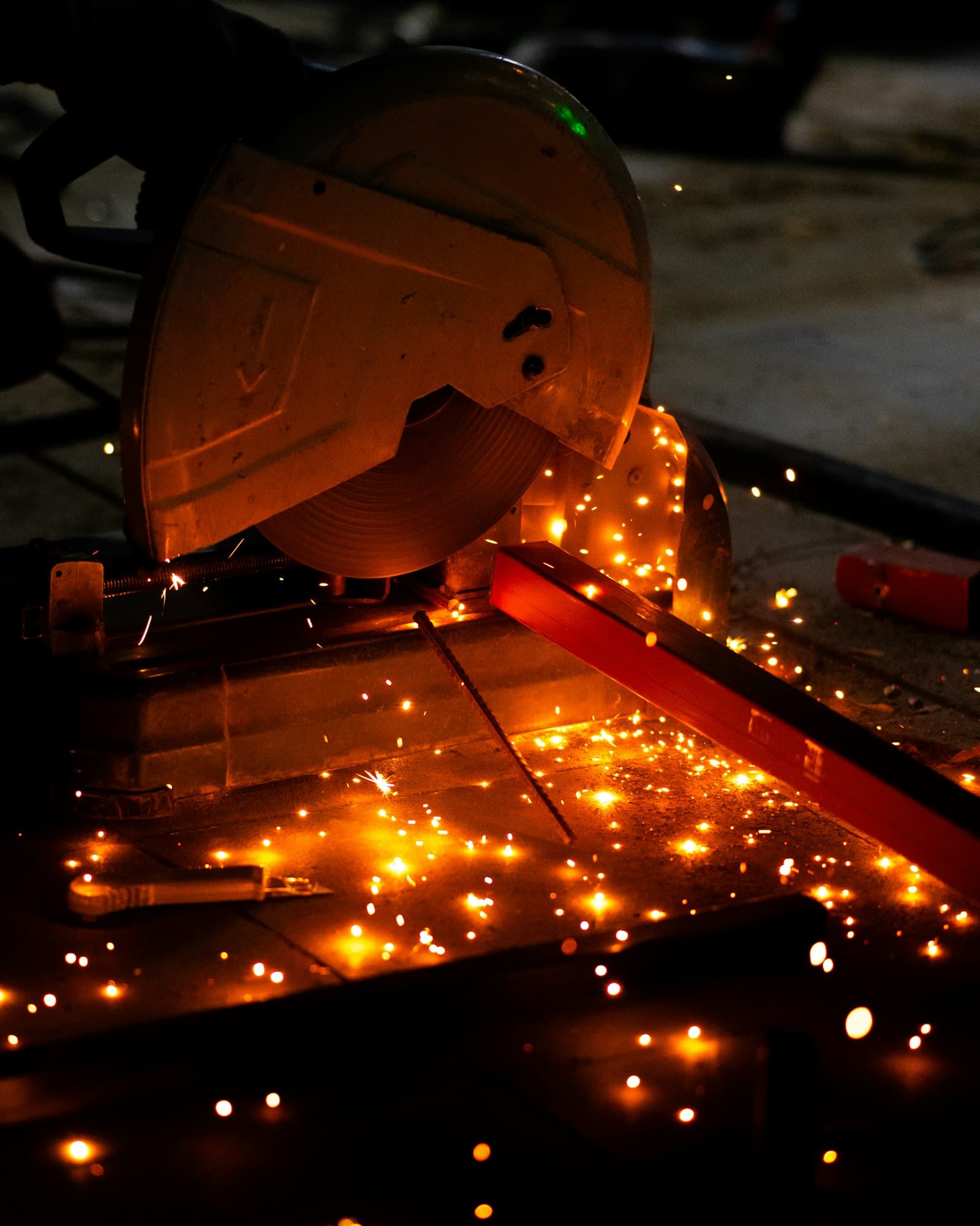Cutting saw throwing sparks in a workshop