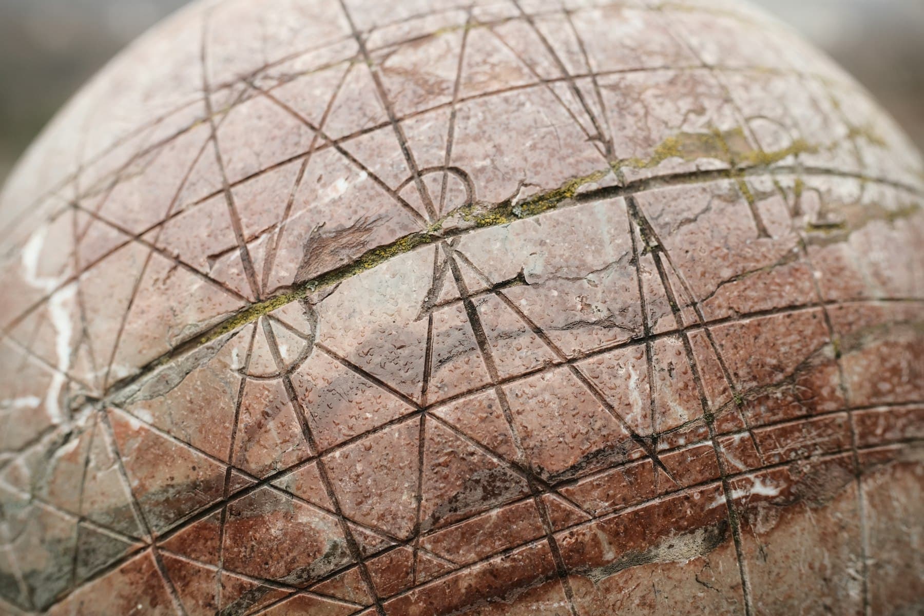 Close view of a turned stone sphere